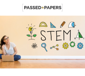 Best STEM careers. Woman sitting on the ground with laptop looking up at STEM in writing and symbols related to STEM