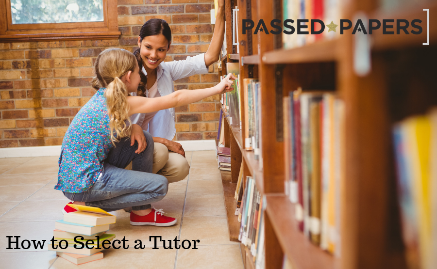 How to select a tutor. Woman and girl choosing books at large book shelf.