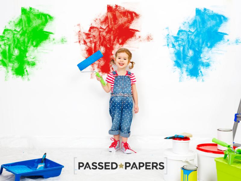How stressed is your child. Child with paint roller and different colours.