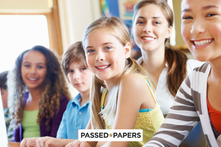 Smiling children in class for Keystage 2 papers